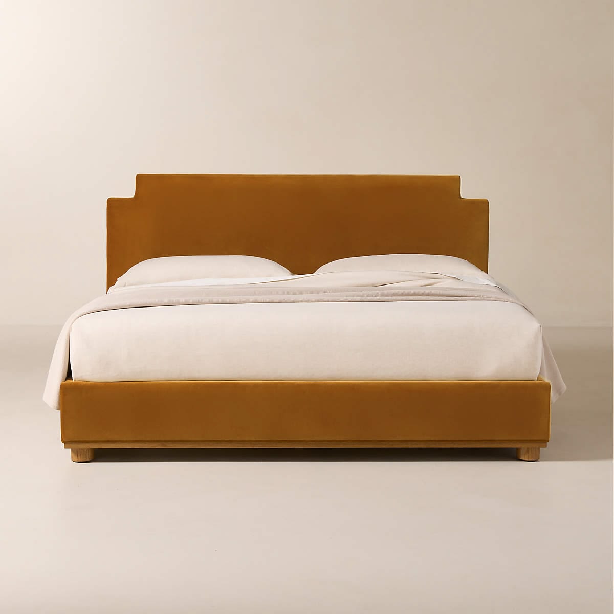 CB2 Plaza upholstered king bed in turmeric